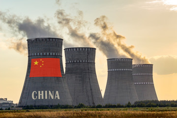 Nuclear plant chimneys displaying flag of China with according text. Energy pollution accidents in...