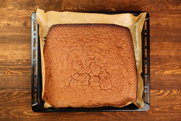 Freshly baked cake on cooking sheet
