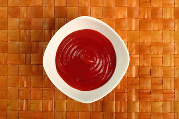 Ketchup in bowl. Directly Above.