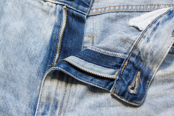 Fototapeta premium Trendy stylish jeans frayed and torn in different places.