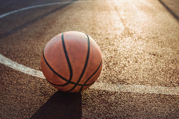 Basketball ball on urban court. Healthy lifestyle and sport concepts.
