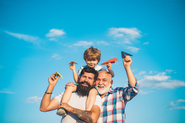 Family generation: future dream and people concept. Boy with father and grandfather. Generations...