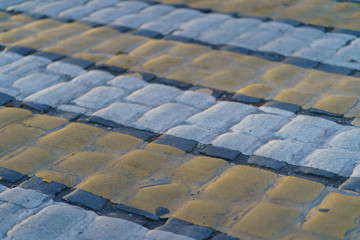Fototapeta premium Colorful pavement on the Moscow street. Pedestrian crosswalk in the sunset.