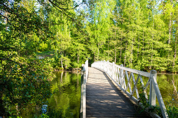 Wooden bridge and spring view, Mustion Linna park, Finland