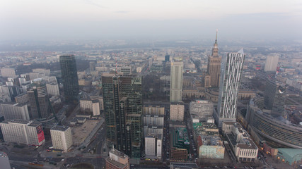 Fototapeta na wymiar Warsaw Poland. 04. December. 2018. Panoramic aerial visas on modern skyscrapers and buildings at dusk.