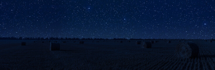 Agricultural night landscape with haystacks © firewings