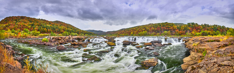 Fototapeta na wymiar Panorama of Sandstone Falls in West Virginia with fall colors.