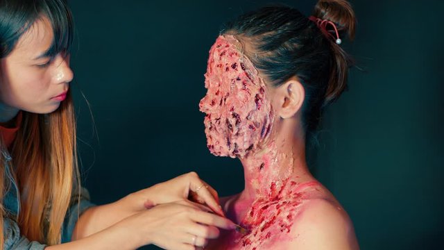Bloody Fake Injuries On woman´s Face Made By Professional Make Up Artist.Close up.