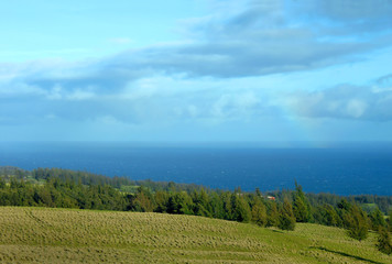 Downhill view of distant Rainbow