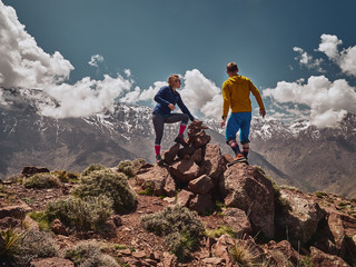 Young couple on a hike watch Toubkal massif