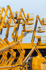 Lot of articulating boom lifts © natagolubnycha