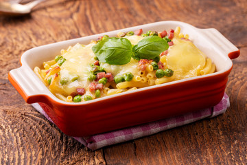 rigatoni emiliana in a casserole on wood