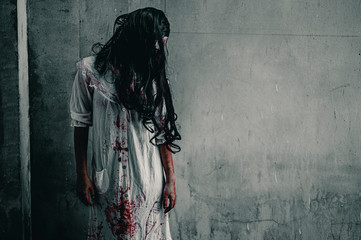 Girl zombie in the blood.The ghost of a woman stand with resentment torture and ask for help, in...