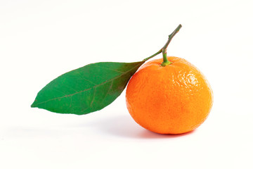 One tangerine with leaf on a white isolated background.