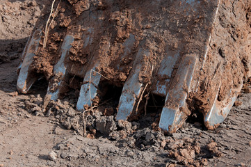 Naklejka premium Large crawler excavator bucket. Machines and mechanisms for construction.