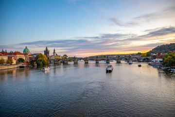 Charles bridge in beautiful sunset lights in october in Prague, Czech Republic
