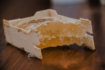 honey in honeycomb on wooden background