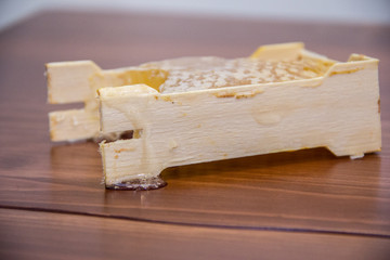 honey in honeycomb on wooden background