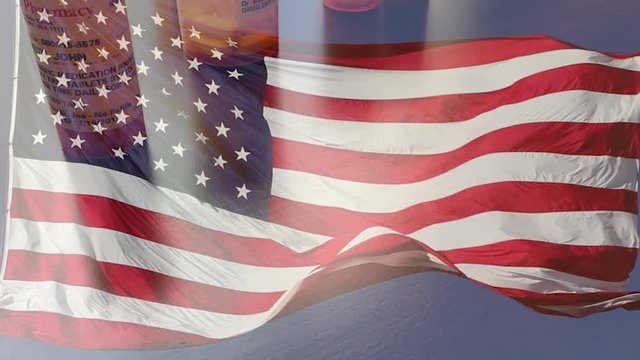 4k Slow Motion Medicine Bottles and Pills Falling With Ghosted American Flag Waving. The medicine bottle labels are non-proprietary with fictitious names, addresses and information designed specifical