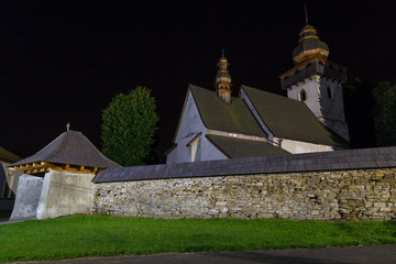 Ancient Gothic Catholic church at night. Village Smrecany, Liptov region, Slovakia