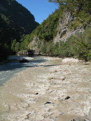 Confluence of two mountain rivers in narrow canyon. Caucasus, Abkhazia