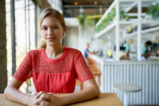 Lifestyle portrait of smiling young trendy millennial businesswo