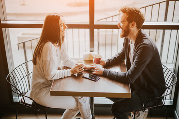 Cheerful young couple enjoying first date