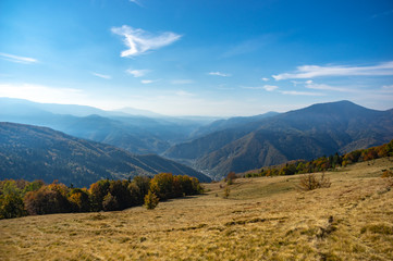 Fototapeta premium Mountains in a blue haze in autumn afternoon