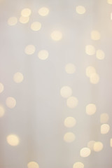 Wooden background with yellow bokeh bulbs.