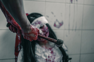 The woman is being attacked by a hammer brutally. Women torture and need help, Halloween murder...
