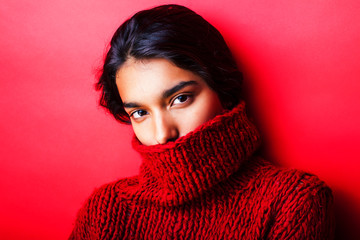 young pretty indian girl in red sweater posing emotional, fashion hipster teenage, lifestyle people...
