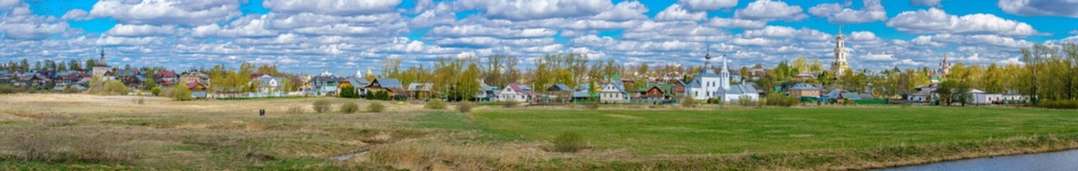 Fototapeta na wymiar Panoramic view of Suzdal, a well preserved old Russian town-museum. A member of the Golden ring of Russia. View from the Kremlin
