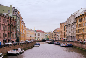 Fototapeta na wymiar view of the Moika river from the embankment in St. Petersburg, buildings of the 18th century along the river.