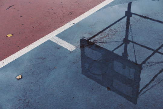 Reflection of basketball backboard in water
