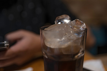Glass of cola drink with ice