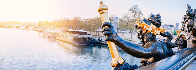 Morning sunlight panoramic view of Seine River from Alexander III bridge (pont Alexandre III) in...