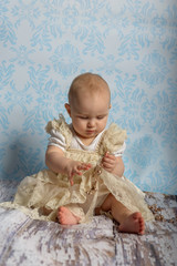 Portrait of adorable baby girl. Childhood. Authentic image.