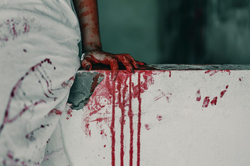 Horror Scene of a Woman with bloody hands sitting with resentment torture and ask for help, in...