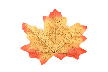 artificial maple leaf made from fabric isolated on white