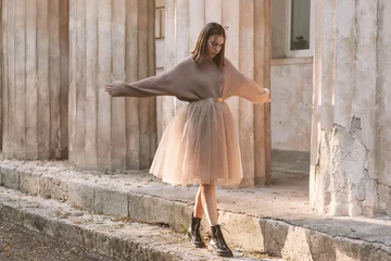 Foto auf Acrylglas Teen girl in brown tulle skirt and autumn sweater © Alena Ozerova