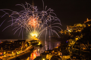 Looe New Years Eve fireworks display at the beach Cornwall