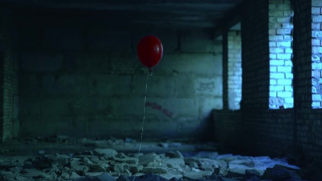 One red balloon luring victim into dangerous abandoned building, thriller story