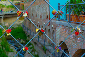Love padlocks on metal wire.