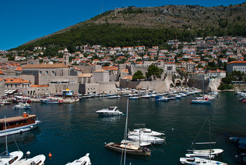 Fototapeta na wymiar Dubrovnik, Croatia: View of the Old Port. Dubrovnik is a Croatian city on the Adriatic Sea. It is one of the most prominent tourist destinations in the Mediterranean Sea