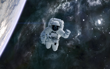 Astronaut in outer space. Supernova explosion. Planet, space landscape. Science fiction. Elements...