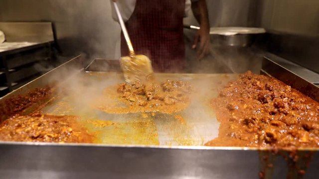 Indian mutton curry preparation at a street food stall