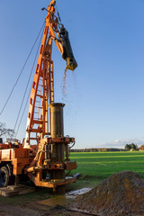 Ground water hole drilling machine installed on a truck. Groundwater well drilling.