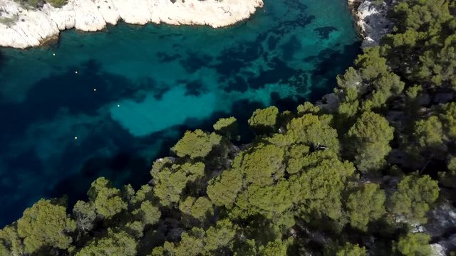 Aerial clip over on the cliffs, Calanques de Port Pin bay, Calanques National Park near Cassis fishing village, Provence, South France, Europe