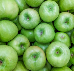 Background green apples. Fruit background. Apples on the apples.