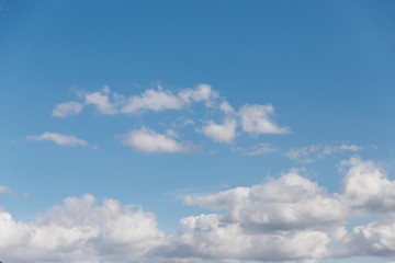 Blue sky background. Beautiful sky with white clouds. Copy space